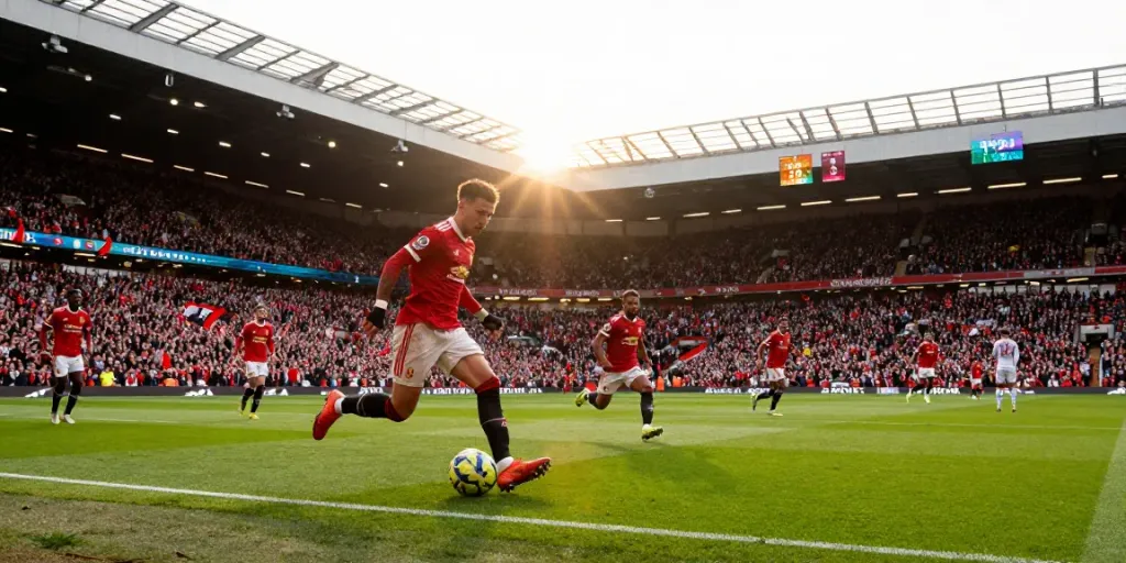 Manchester United vs Liverpool match showcasing competitive intensity, players in action with enthusiastic fans in the background.